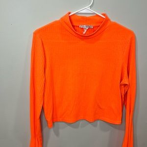 Bright orange long sleeve crop top